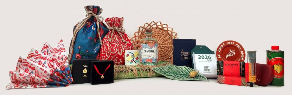 Assortment of Portuguese souvenirs and gift items on a white background, including patterned fabric bags, soaps, stationery, a woven basket, and a decorative bottle