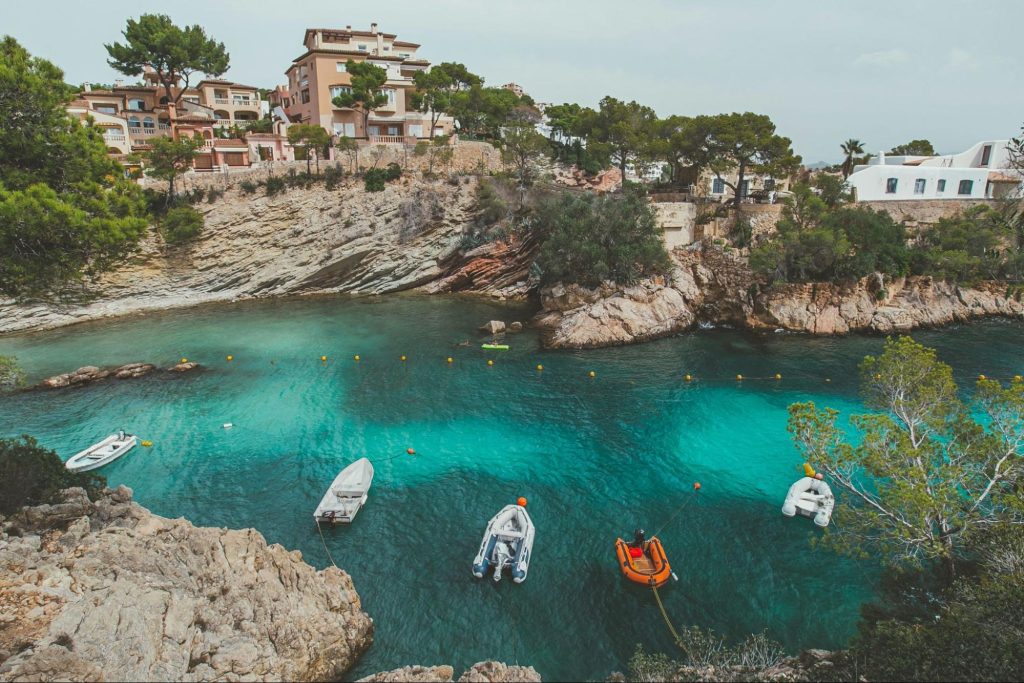 Turquoise cove in Mallorca with boats