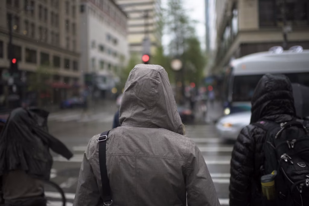 People walking in rain jackets on a Seattle street